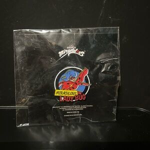 Miraculous enamel pin